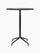 Front view of the Harbour Column Bar Table, featuring a round, charcoal linoleum top on a slim black column with a star base.
