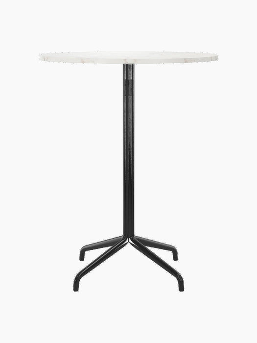 Front view of the Harbour Column Bar Table with a round, Estremoz marble top, a slender black column, and a black star base.
