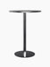 A Harbour Column Bar Table with a round, black-stained oak veneer top and slender black powder-coated steel column and base.