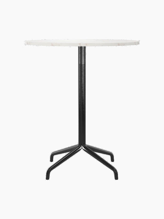 A front view of the Harbour Column Counter Table, featuring a round Estremoz marble top and a black, four-legged star base.