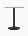 Harbour Column Counter Table with a round, light marble top, slender black column, and circular base.