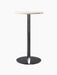 The Harbour Column Counter Table with a round, off-white marble top and a slender black column with a circular base.