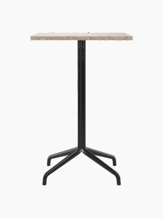 A front view of the Harbour Column Counter Table, featuring a rectangular Kunis Brescia tabletop and a black star base.
