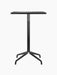 Front view of the Harbour Column Counter Table with a rectangular charcoal linoleum top and a black metal star base.