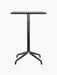 Front view of the Harbour Column Counter Table with a rectangular black oak top and a black star base on a black background.