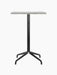Front view of the Harbour Column Counter Table with a rectangular Estremoz marble top and a black star base.