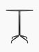Front view of the Harbour Column Counter Table, featuring a round black oak top and a slender black column with a star base.