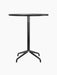 A front view of the Harbour Column Counter Table, featuring a round charcoal linoleum tabletop and a black starbase.