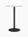 The Harbour Column Counter Table with a rectangular light-coloured top, black fluted stand, and circular base.