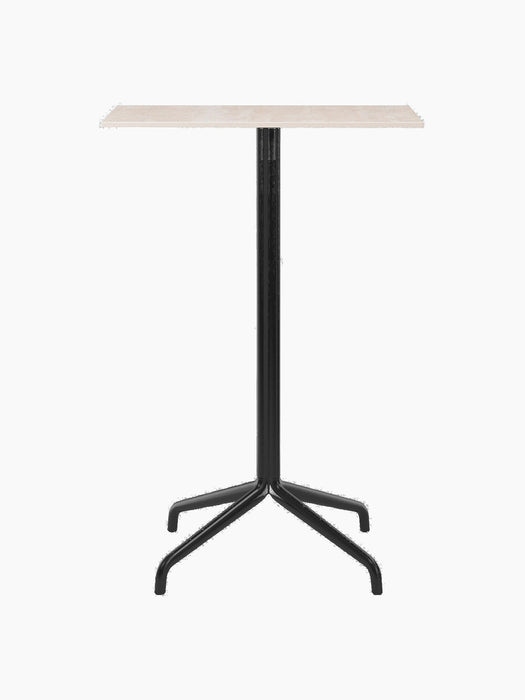 Front view of the Harbour Column Counter Table with a light-coloured rectangular top and a slim black four-legged star base.