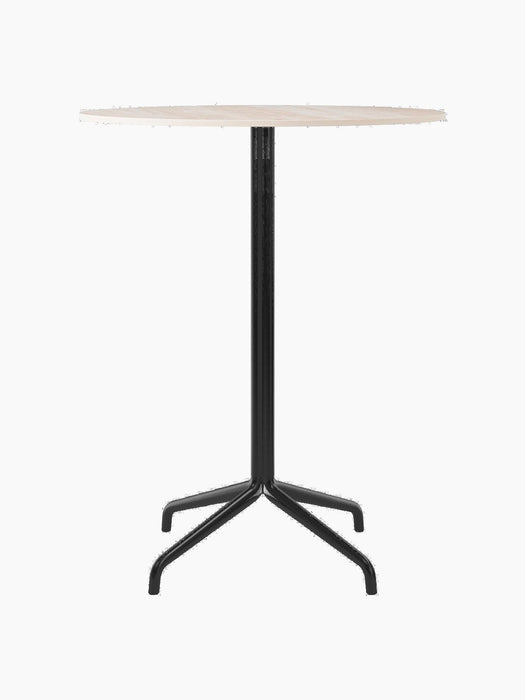 The Harbour Column Counter Table, shown from the front with a round, light-coloured top and a slender black star-shaped base.