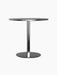 A Harbour Column Dining Table with a round, black oak veneer top and a matching black metal column with a circular base.