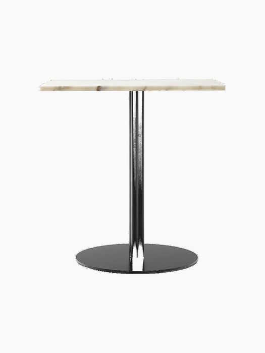 The Harbour Column Dining Table with a rectangular off-white marble top, standing on a single black column with a round base.