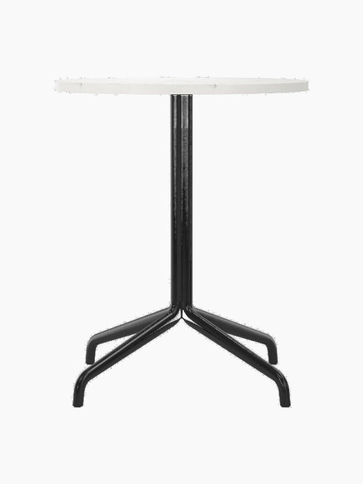 Front view of the Harbour Column Dining Table with a round Estremoz marble top and a slender black column with a star base.