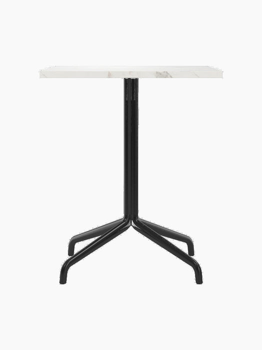 Front view of the Harbour Column Dining Table. It has a rectangular white Estremoz marble top and a black star base.
