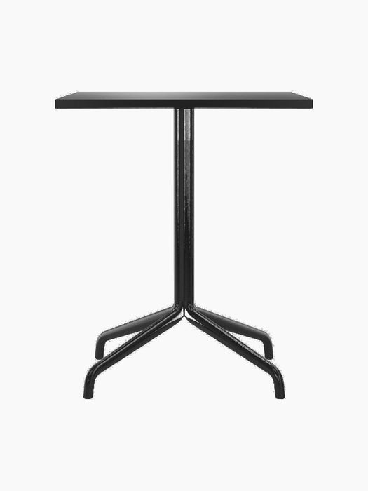 Front view of the Harbour Column Dining Table with a rectangular charcoal linoleum top and a black star-shaped base.