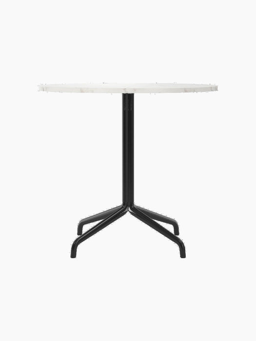 Front view of the Harbour Column Dining Table with a round, white Estremoz marble top and a black star-shaped metal base.