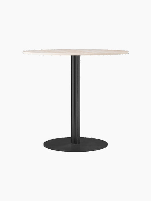 Front view of the Harbour Column Dining Table with a round, light-coloured top and a fluted black column on a round base.