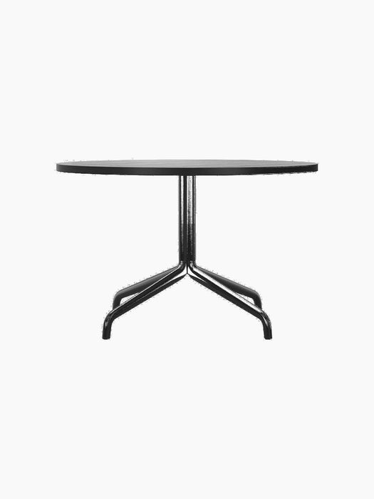 Harbour Column Lounge Table with a round black oak top and a black star-shaped base against a black background.