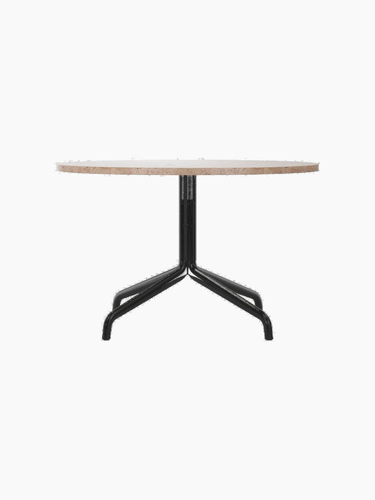 A circular Harbour Column Lounge Table with a beige Kunis Breccia stone top and a black powder-coated steel star base.