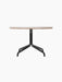 A circular Harbour Column Lounge Table with a beige Kunis Breccia stone top and a black powder-coated steel star base.