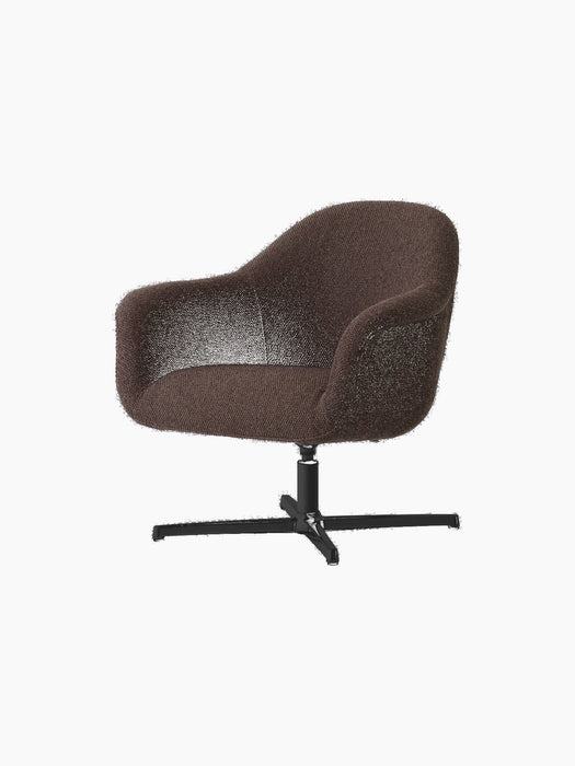 Angled view of the Harbour Lounge Chair, upholstered in dark brown Baena 15 fabric with a black aluminium star swivel base.