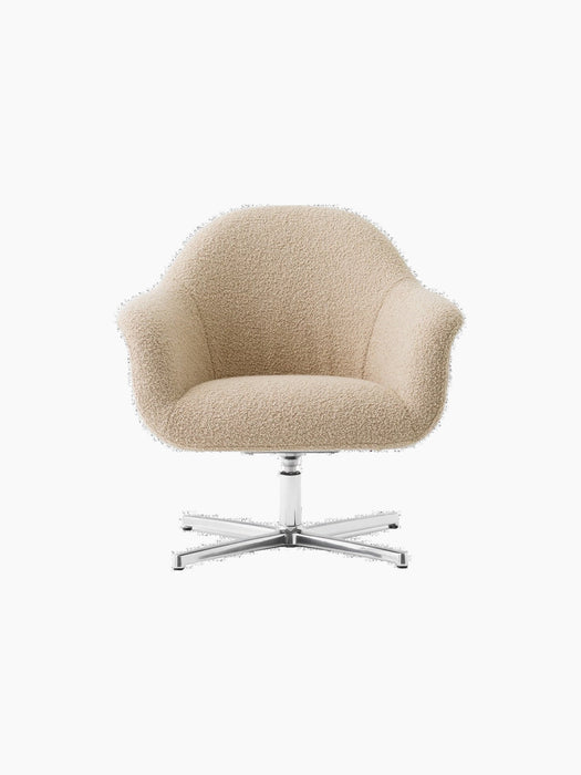 Front view of the Harbour Lounge Chair upholstered in light beige Baena 15 fabric with a polished aluminium swivel star base.