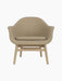 Front view of the Harbour Lounge Chair, featuring a natural oak frame and upholstered in a light beige Audo Bouclé 02 fabric.