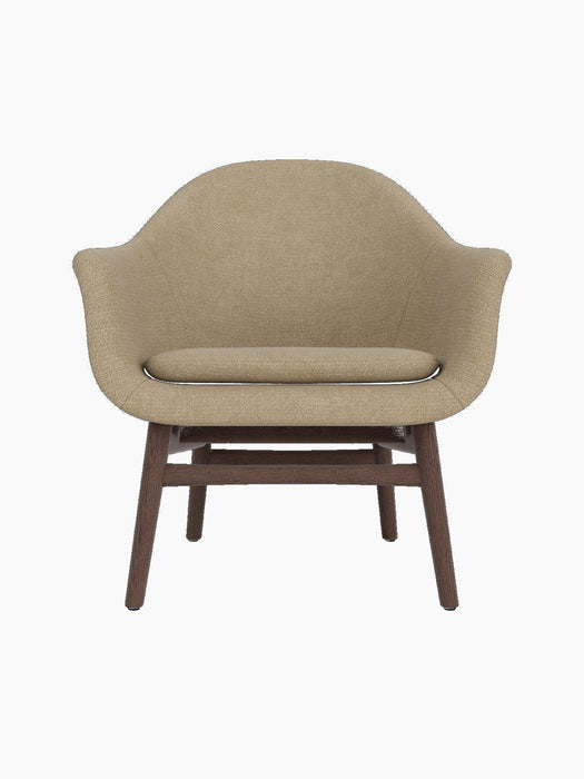 Front view of Harbour Lounge Chair with a dark stained oak frame and light brown Audo Bouclé 02 upholstery and seat cushion.