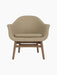 A front-facing view of the Harbour Lounge Chair, upholstered in light brown Audo Bouclé 02 fabric on a solid walnut frame.