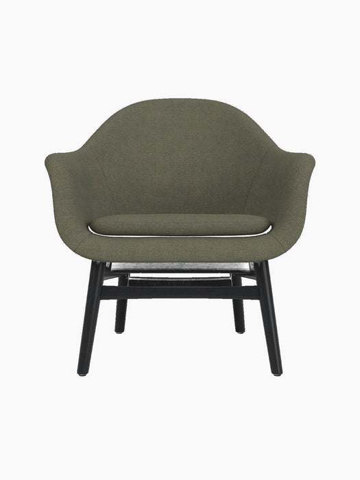 A front-on studio shot of the Harbour Lounge Chair, featuring olive-green Fiord 961 fabric and a black painted oak base.