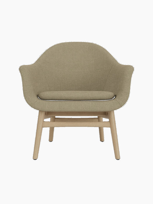 A front-facing studio shot of the Harbour Lounge Chair, featuring a natural oak frame and a beige textured fabric upholstery.