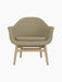 A front-facing studio shot of the Harbour Lounge Chair, featuring a natural oak frame and a beige textured fabric upholstery.