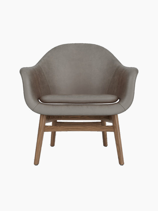 A front view of the Harbour Lounge Chair with a walnut frame and curved shell upholstered in taupe Dakar 0311 fabric.