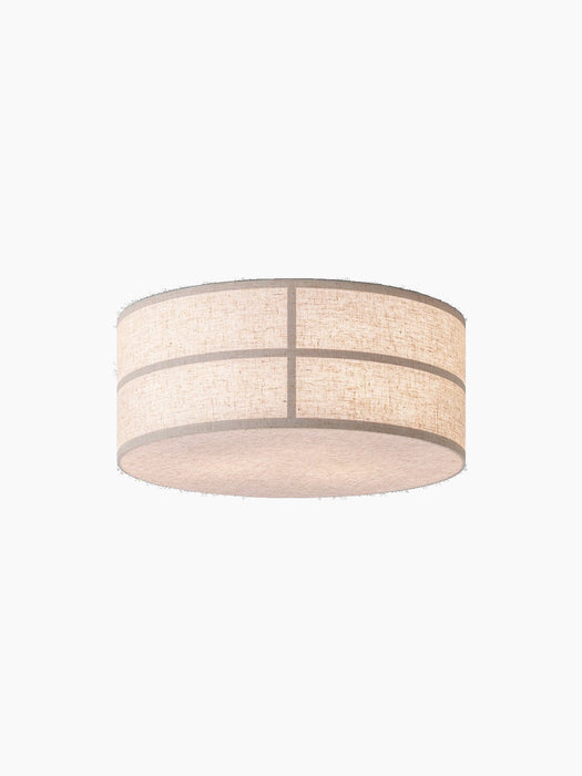 Low-angle view of the illuminated Hashira Ceiling Lamp in Raw, isolated on a black background, highlighting its texture.