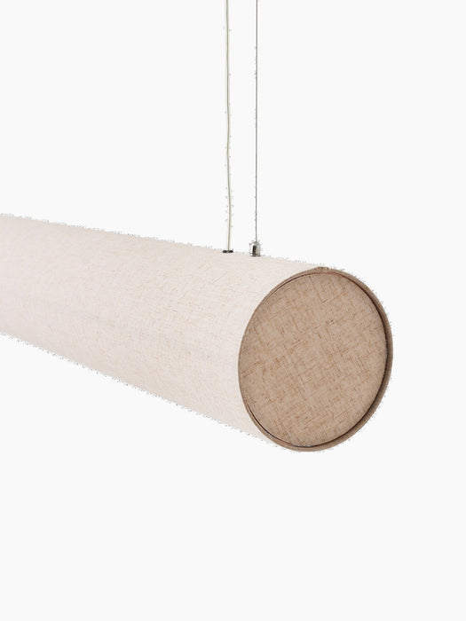 Close-up of the Hashira Linear Pendant Lamp's raw linen shade, end cap, and suspension cables against a black background.