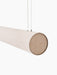 Close-up of the Hashira Linear Pendant Lamp's raw linen shade, end cap, and suspension cables against a black background.