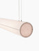 A close-up, angled view of the illuminated Hashira Linear Pendant Lamp, showing the textured raw linen shade and end cap.