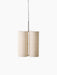 Studio shot of the Hashira Pendant Lamp, Cluster, featuring three raw linen shades on a black fixture, black background.
