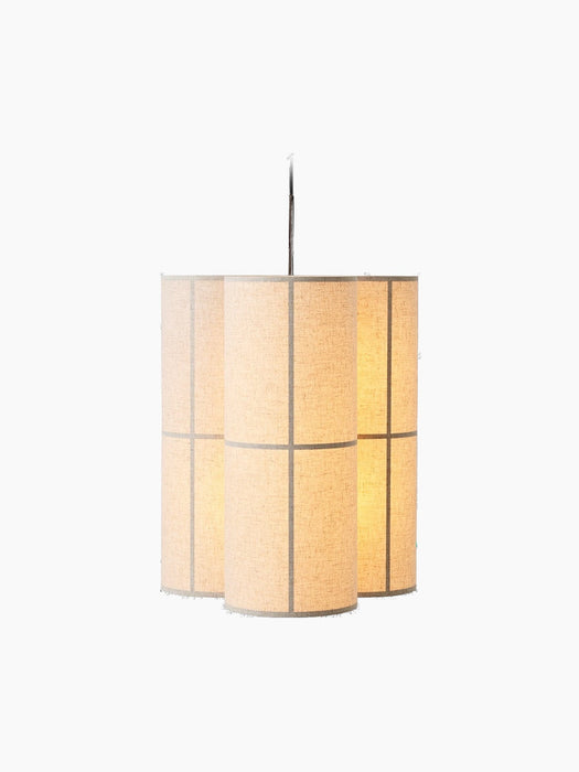 Lit Hashira Pendant Lamp, Cluster. Three cylindrical shades in raw linen hang together against a black background.