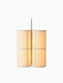 The Hashira Pendant Lamp, Cluster, seen from an angle. Three cylindrical linen shades glow warmly against a black background.