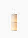 A front view of the Hashira Pendant Lamp, illuminated against a black background. The cylindrical shade is made of raw linen.