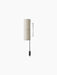 A Hashira Wall Lamp with a cylindrical, textured raw linen shade. It has a black wall mount and a black cord with a switch.