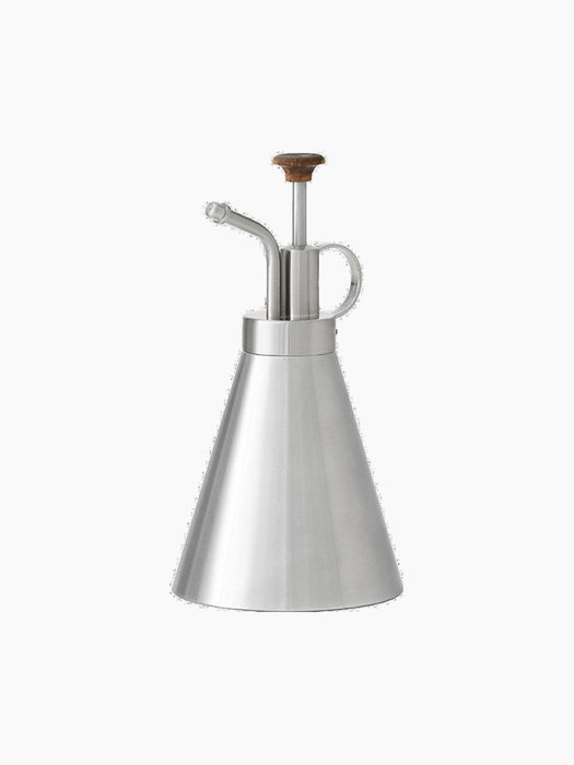 Hydrous Plant Mister with a conical brushed steel body. It has a pump mechanism with a dark wooden knob and a curved nozzle.