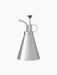The Hydrous Plant Mister, a stainless steel sprayer with a conical body, a curved spout, and a wooden pump handle.