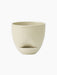 Front view of the Hydrous Planter in a pale Ashen colour. The ceramic planter has a rounded bowl shape and a matching saucer.