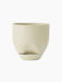 Front view of the Hydrous Planter in Ashen. The rounded, glossy planter has a subtle indent and matching saucer.