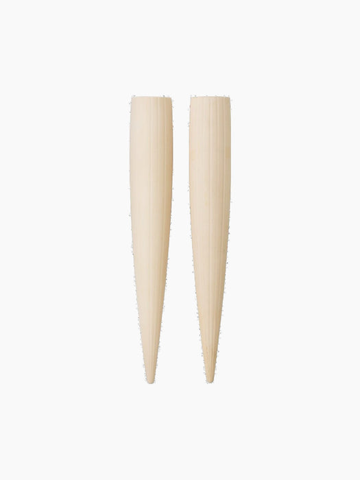 Two cone-shaped, cream-coloured Hydrous Watering Sticks with a vertically fluted texture against a black background.