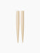 A pair of cream-coloured Hydrous Watering Sticks with a ridged texture, tapering to a point, against a black background.