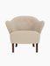 Front view of the Ingeborg Lounge Chair in textured beige fabric, with a button-tufted back and smoked oak legs.